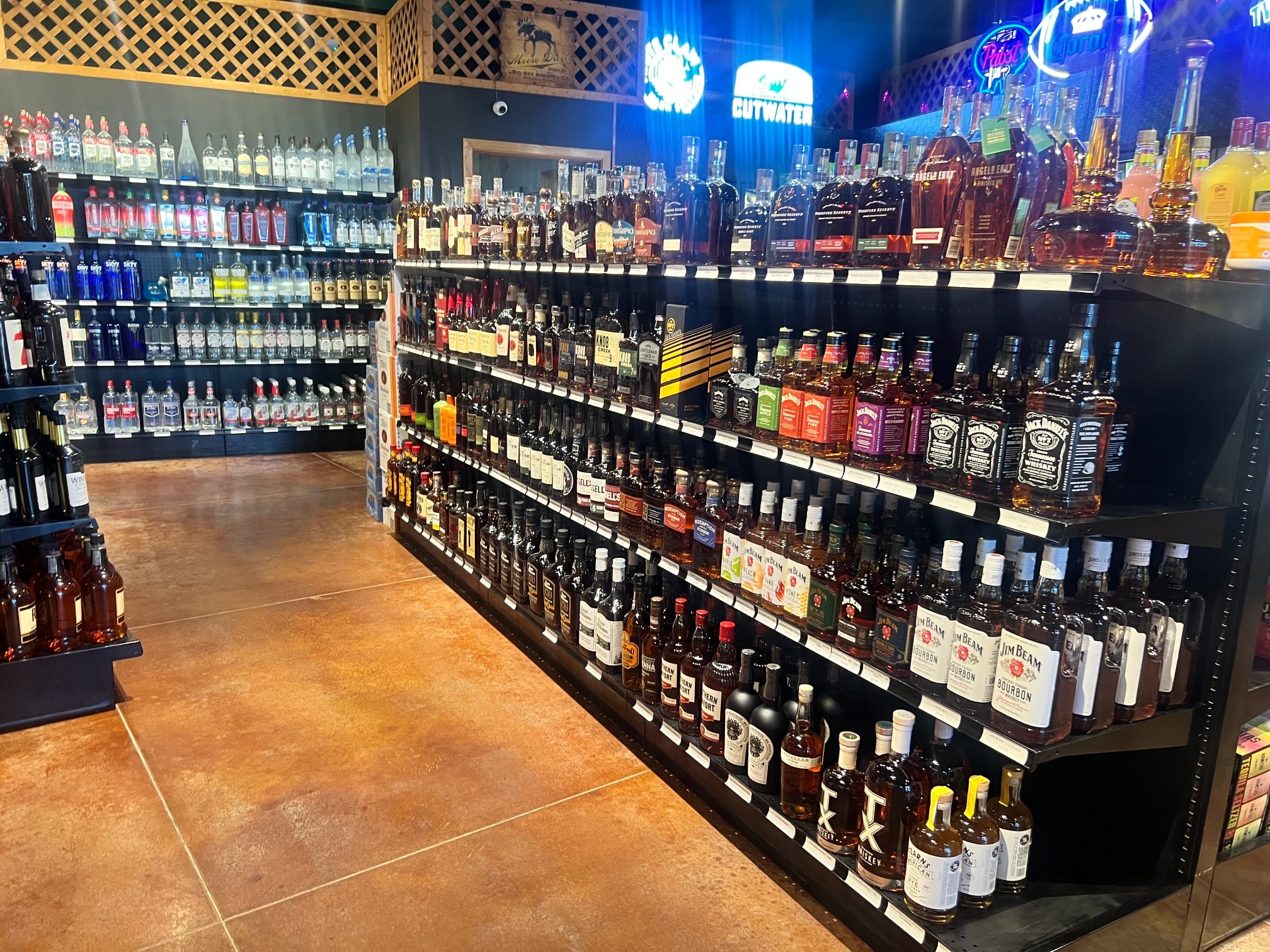 Spirits aisle with neon signs